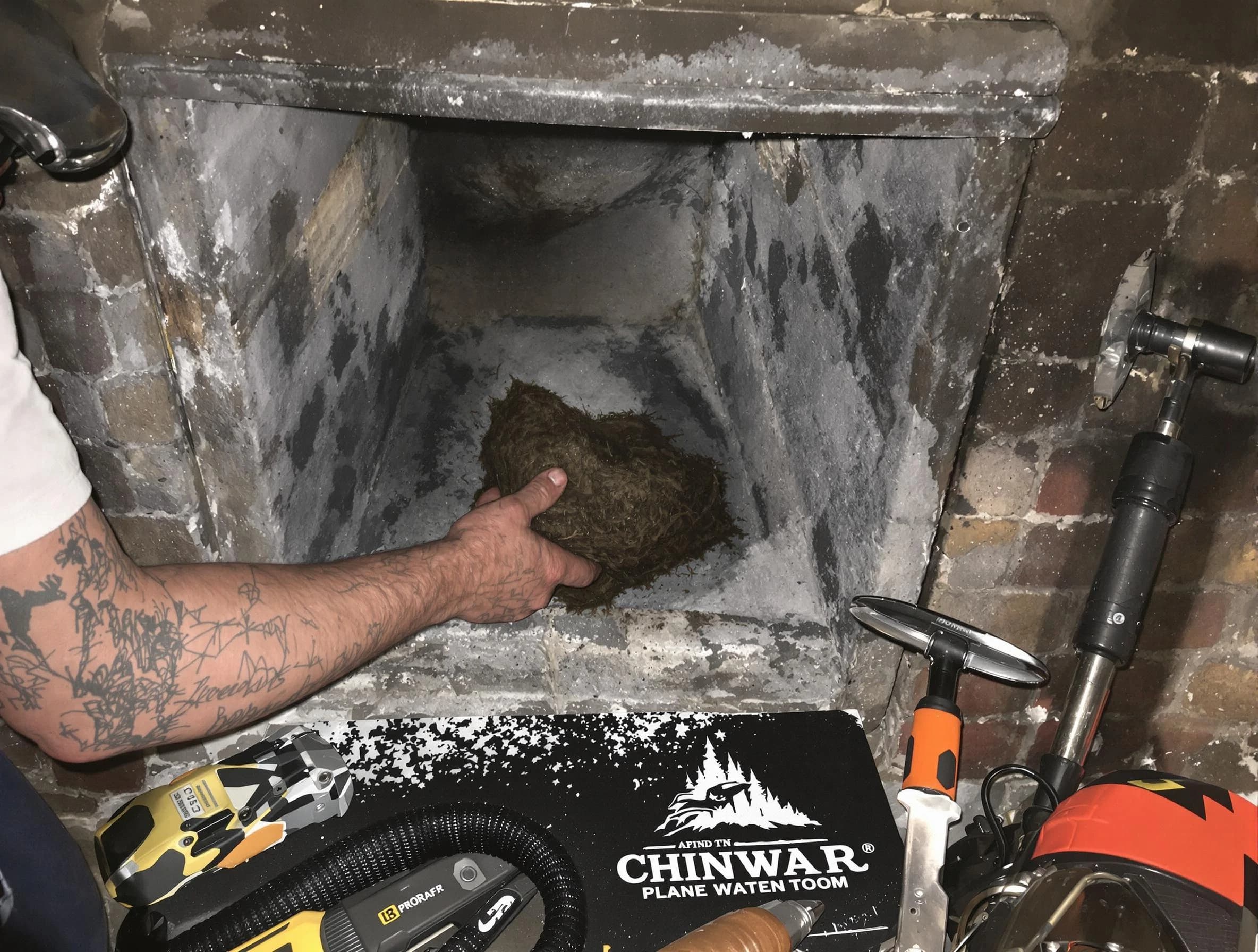 Revere Chimney Sweep safely removing debris and screening chimney in Revere, MA